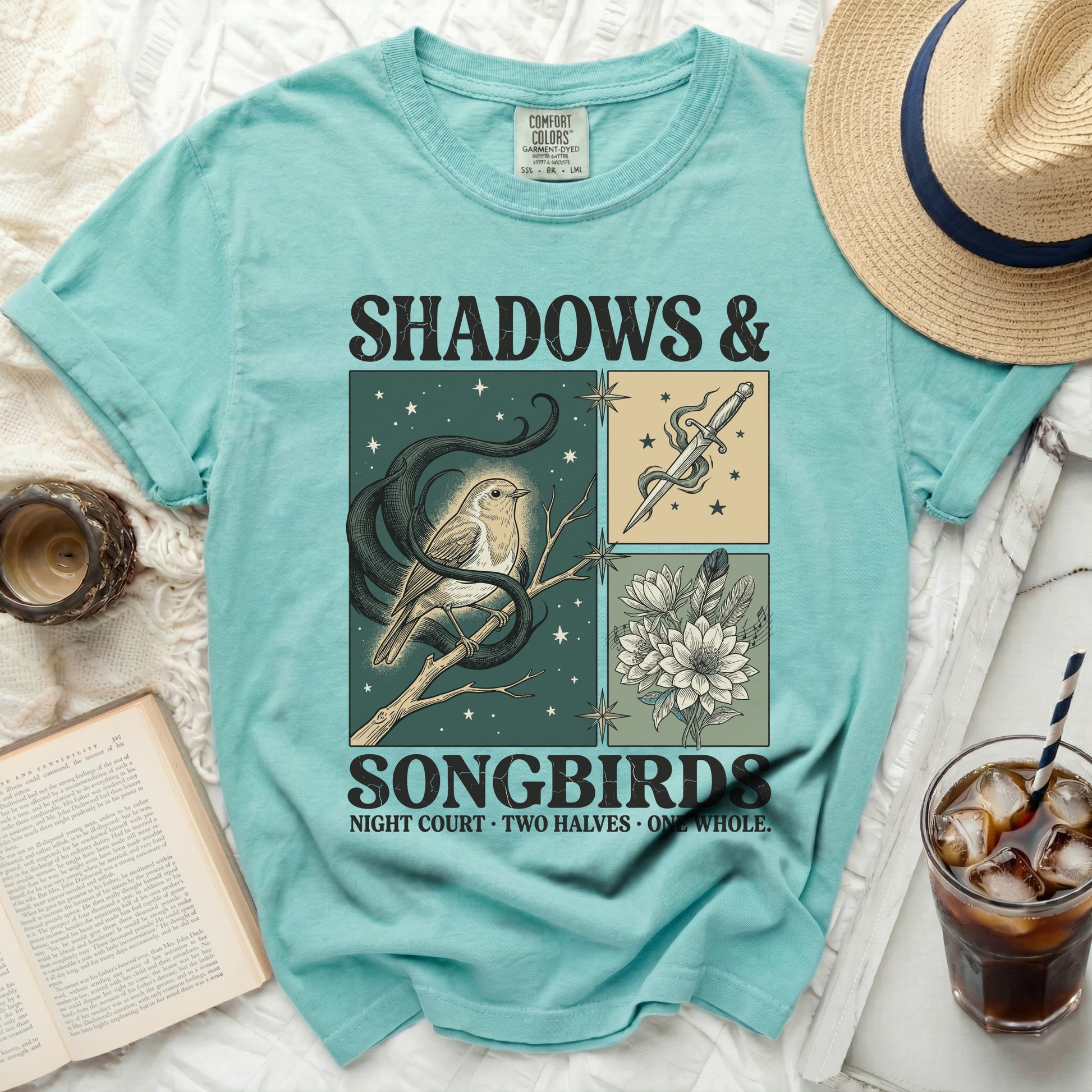 Teal t-shirt with "Shadows & Songbirds" graphic of a bird and dagger.