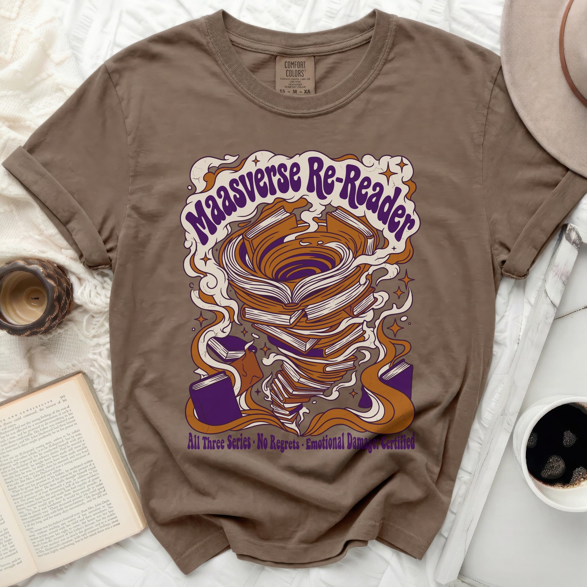 Brown t-shirt with "Maasverse Re-Reader" text and swirling book design.