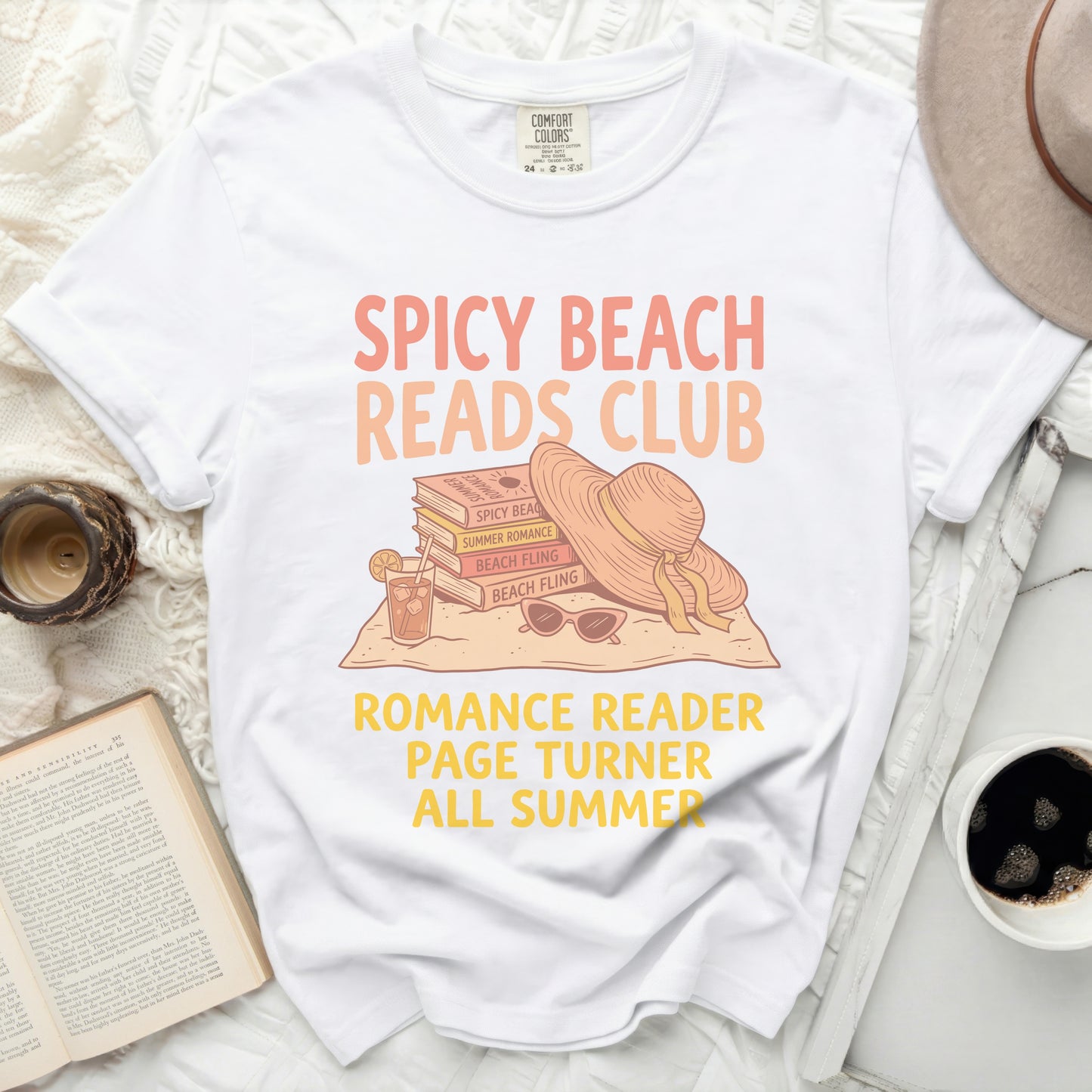 White t-shirt with "Spicy Beach Reads Club" books and hat design.