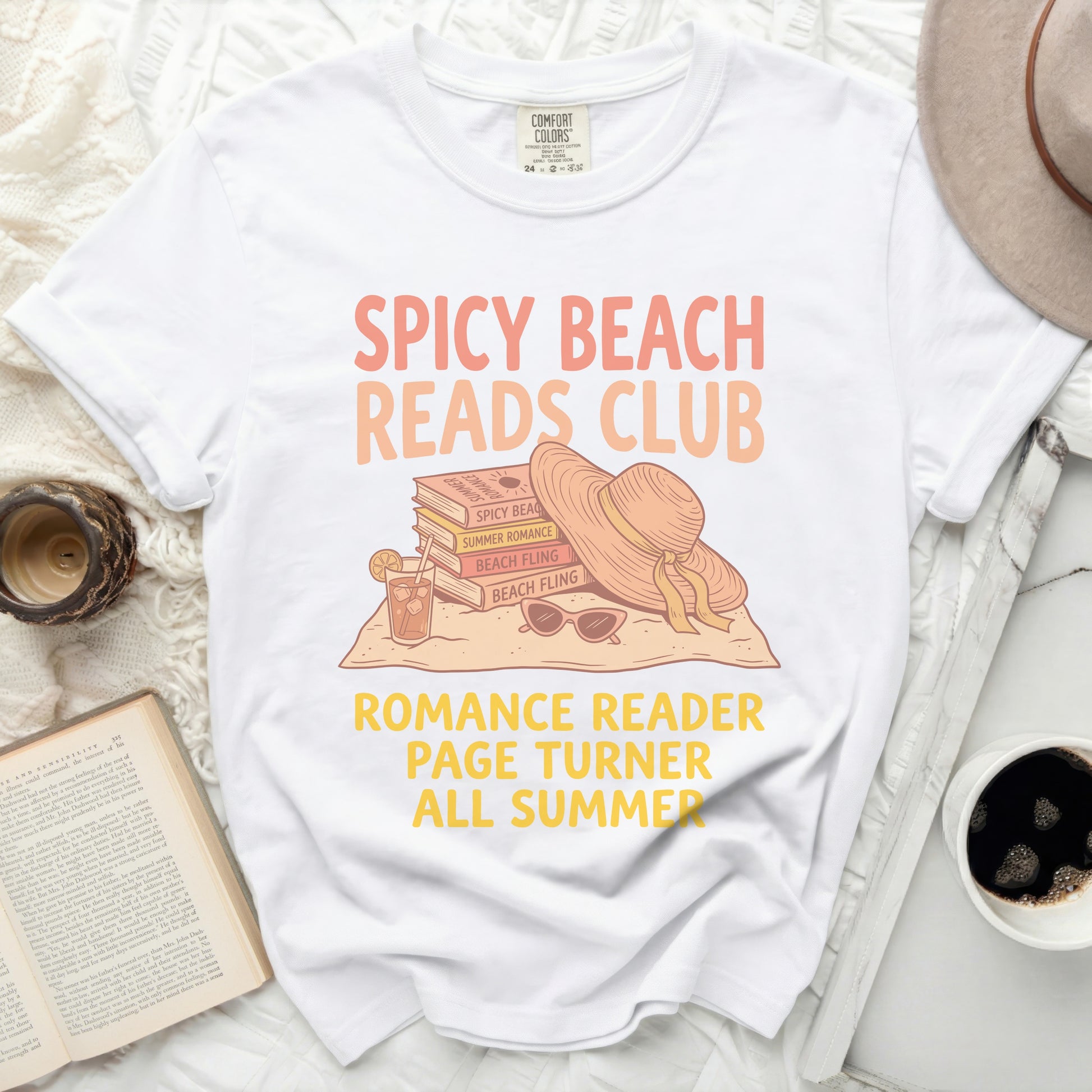 White t-shirt with "Spicy Beach Reads Club" books and hat design.