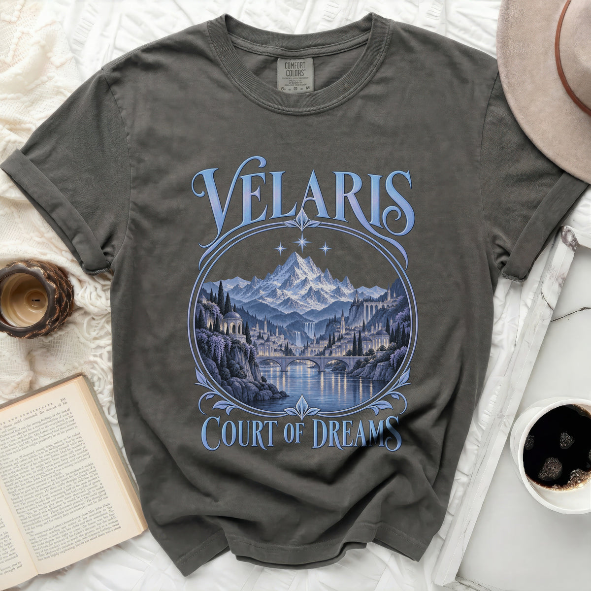 Velaris Court of Dreams graphic t-shirt with a serene cityscape and mountains.