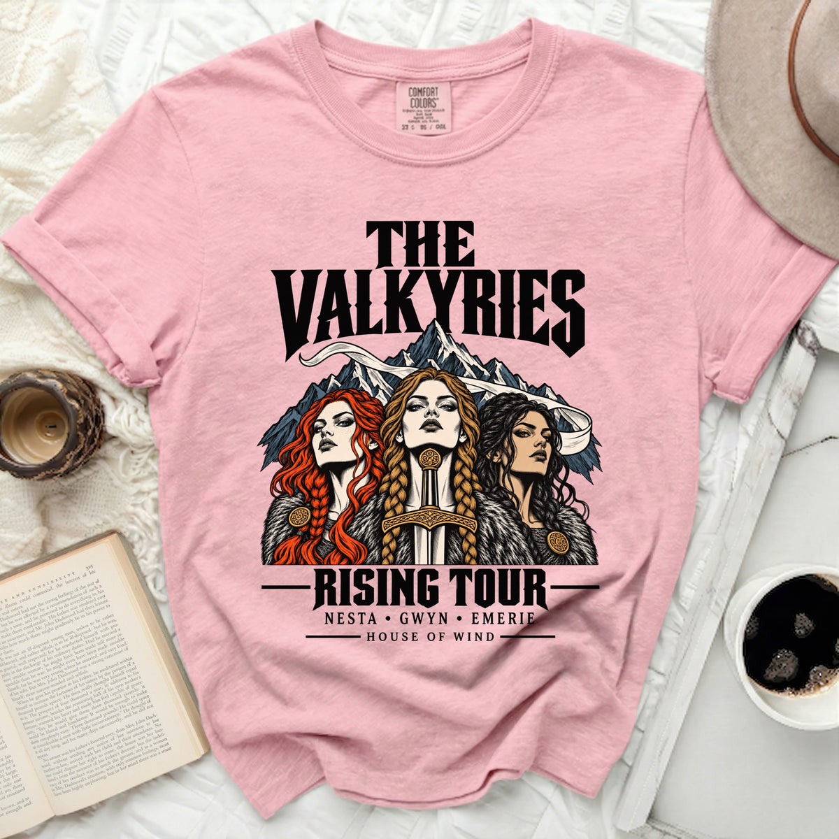 Pink t-shirt with "The Valkyries Rising Tour" text and three women.