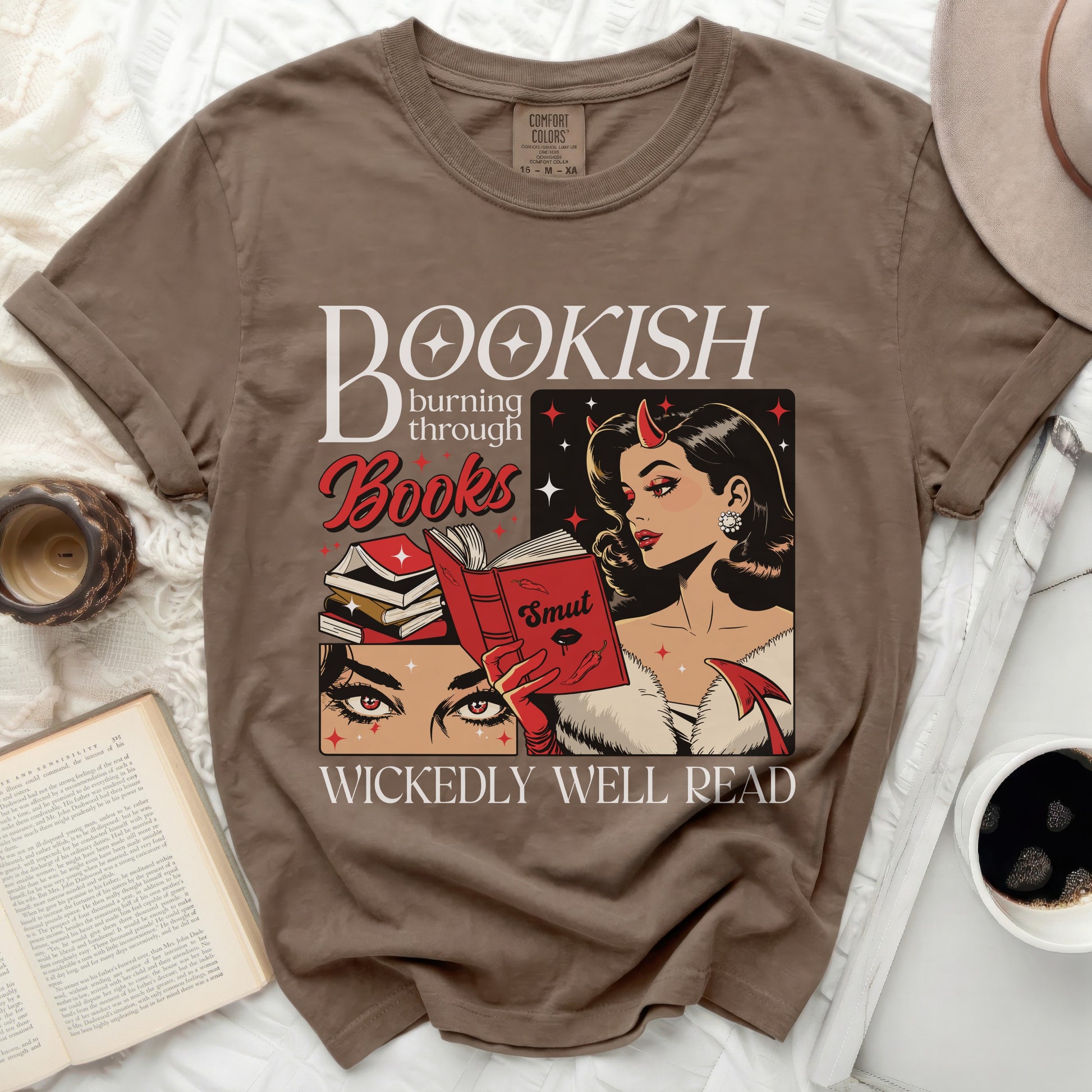 Bookish burning through Books, devil girl reading "Smut," with text "Wickedly Well Read."