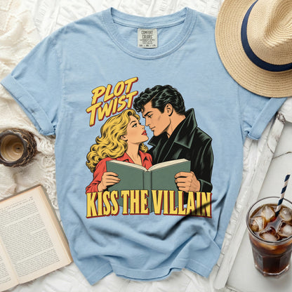 Light blue t-shirt with comic book style graphic "Plot Twist Kiss The Villain"