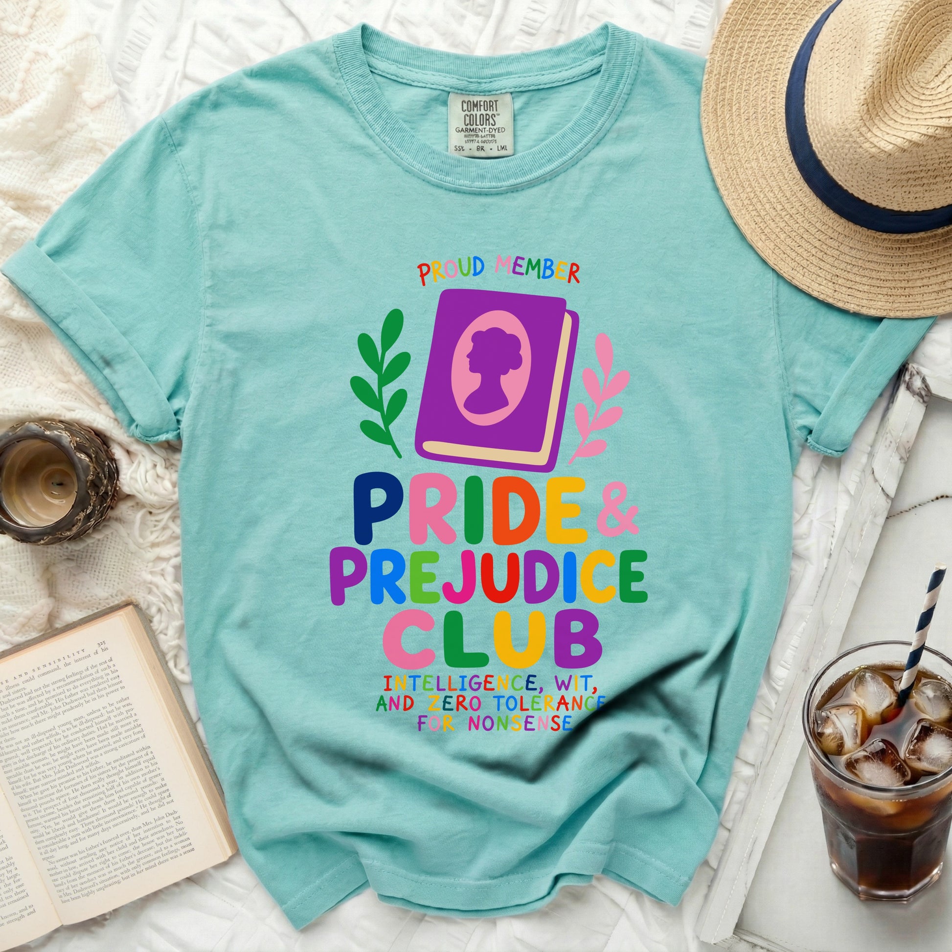 Teal t-shirt with "Pride & Prejudice Club" and quote in colorful text.
