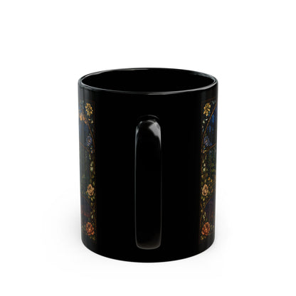 Black mug with a dark floral and vine design on the side.