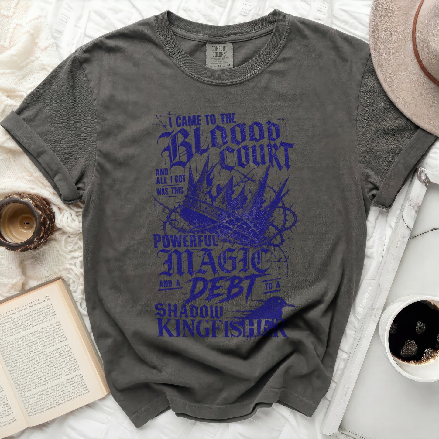 Dark grey t-shirt with "Blood Court Magic Shadow Kingfisher" text design.