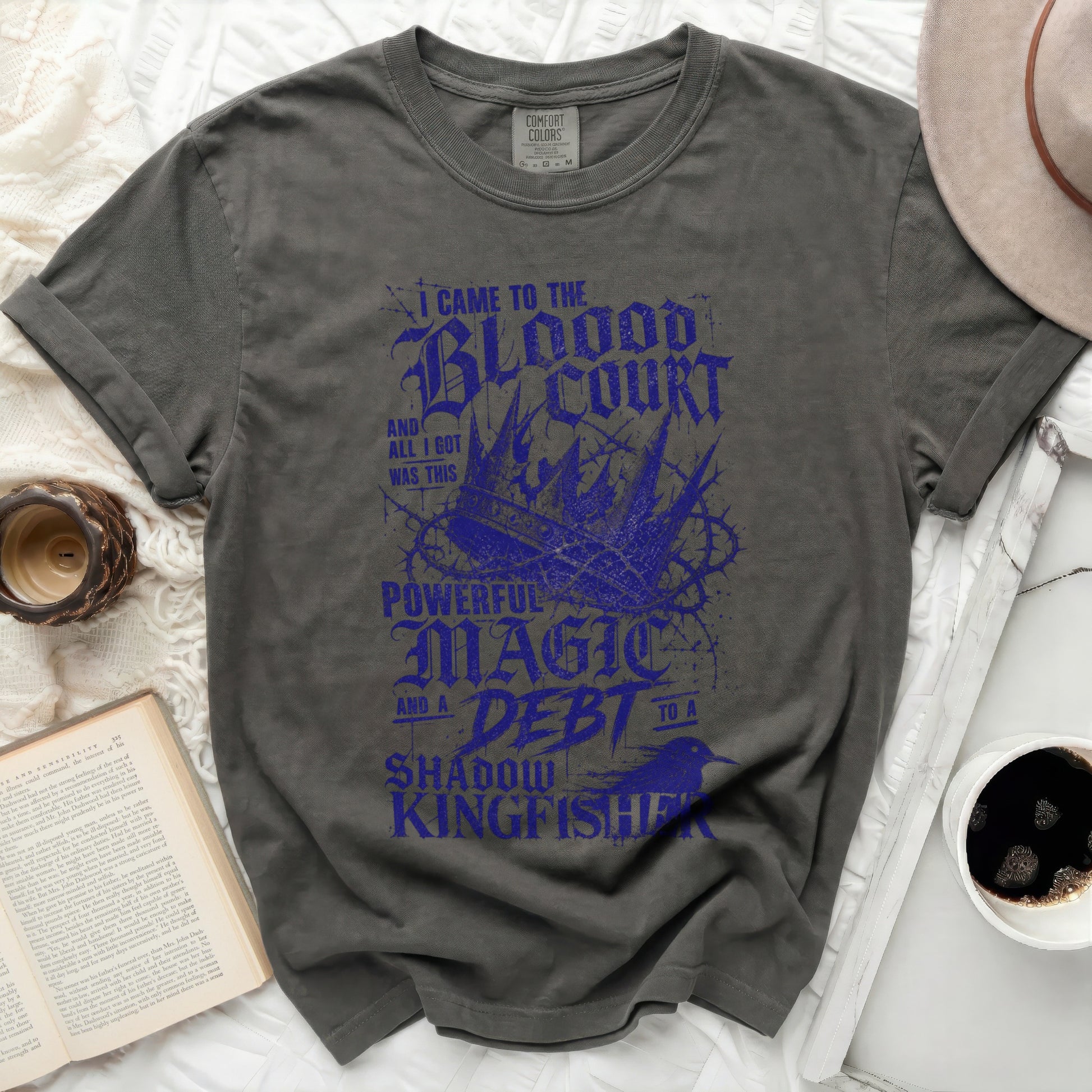 Dark grey t-shirt with "Blood Court Magic Shadow Kingfisher" text design.