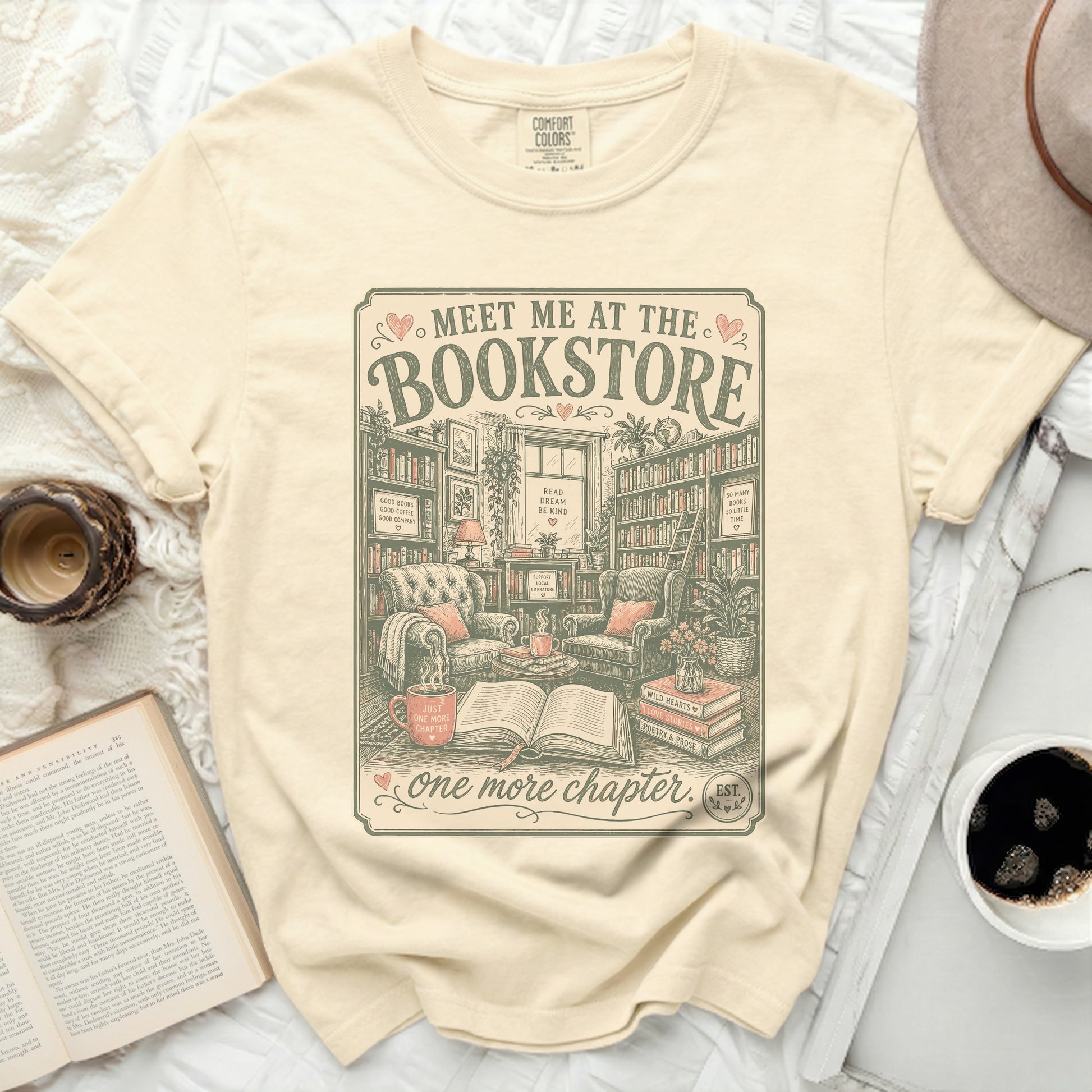 T-shirt with "Meet me at the Bookstore" graphic and book-themed quotes.