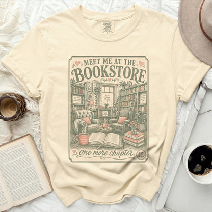 T-shirt with "Meet me at the Bookstore" graphic and book-themed quotes.