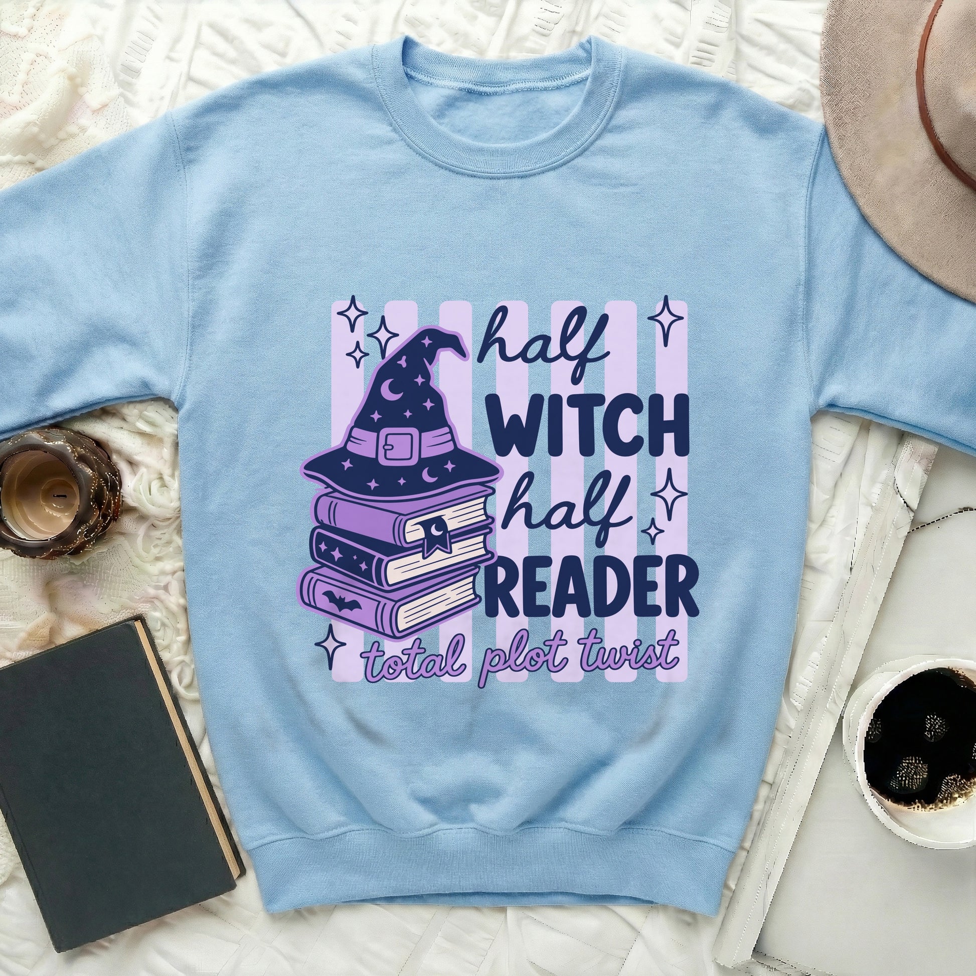 Light blue sweatshirt with "half witch half reader total plot twist" graphic.