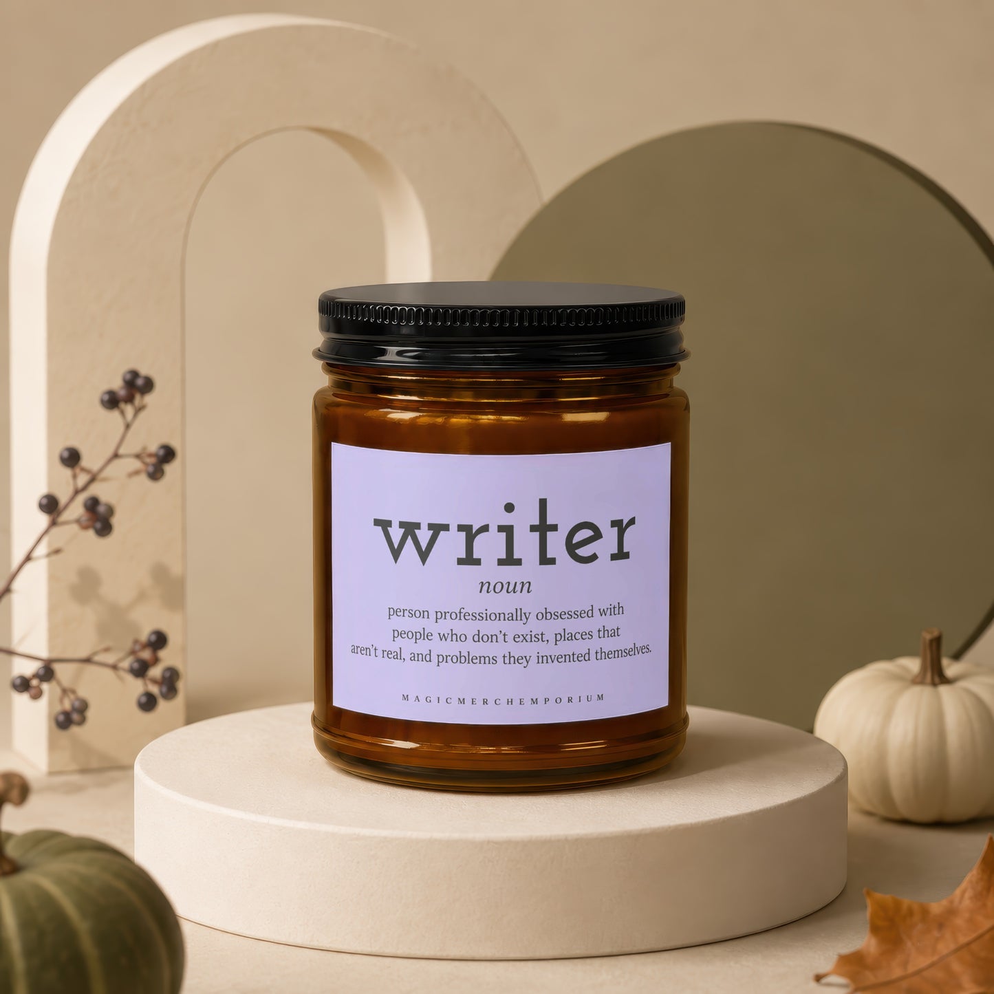 Brown glass candle labeled "Writer" with dictionary definition on a decorative stand.