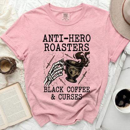 Pink t-shirt with "Anti-Hero Roasters Black Coffee & Curses" graphic.
