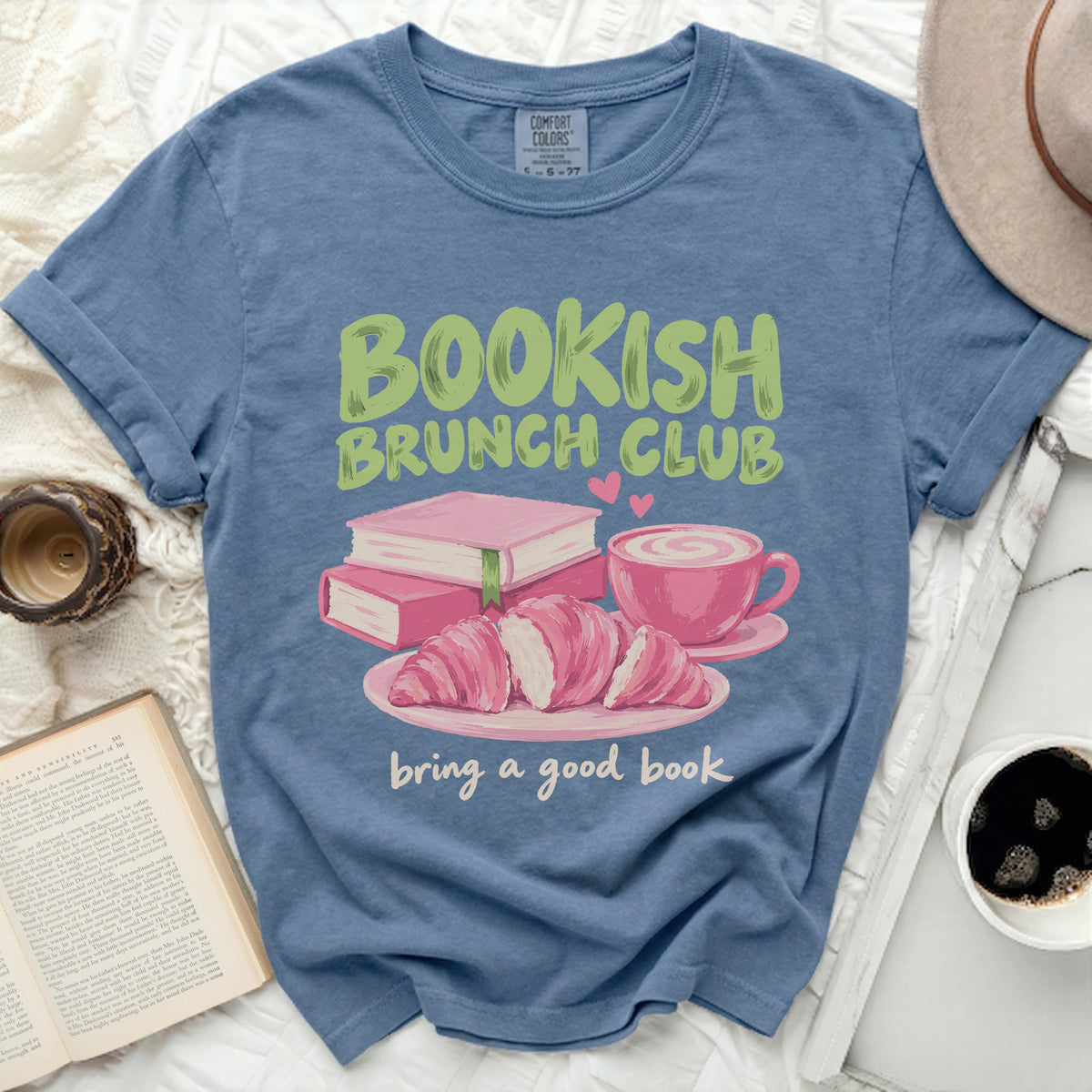 T-shirt graphic with "Bookish Brunch Club" text, books, croissants, and coffee.