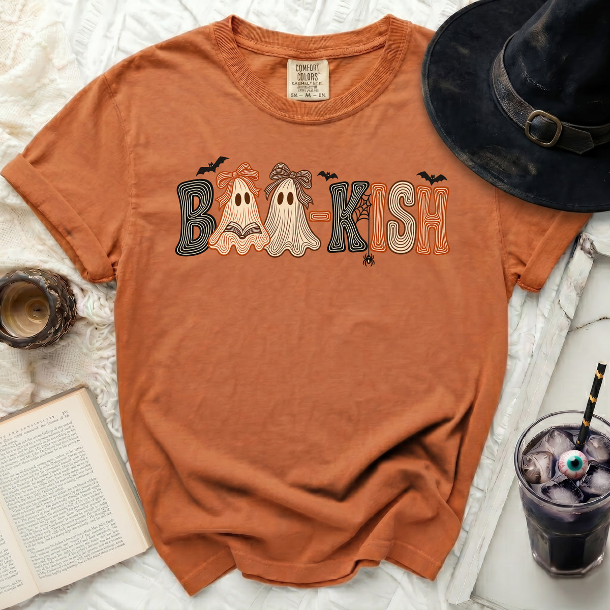 Orange t-shirt with "BAA-KISH" text featuring ghosts and bats