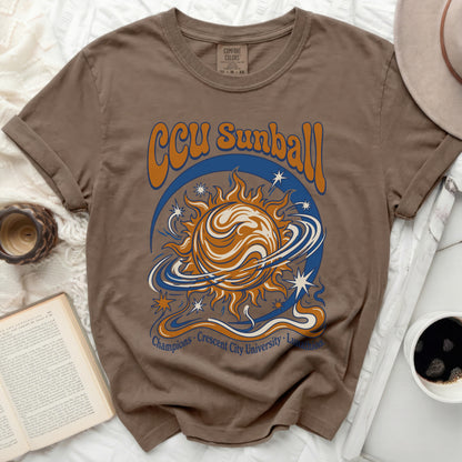 Brown Comfort Colors t-shirt with CCU Sunball graphic.