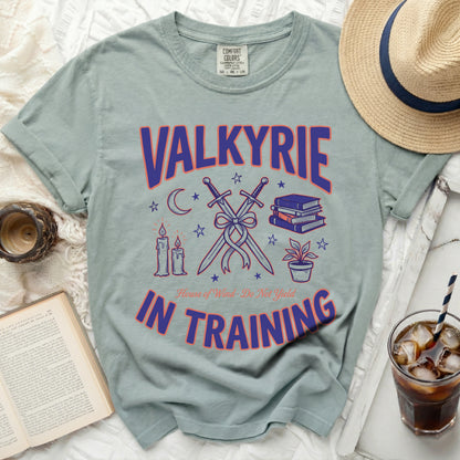 Light sage t-shirt with "VALKYRIE IN TRAINING" text, swords, books, and candles.