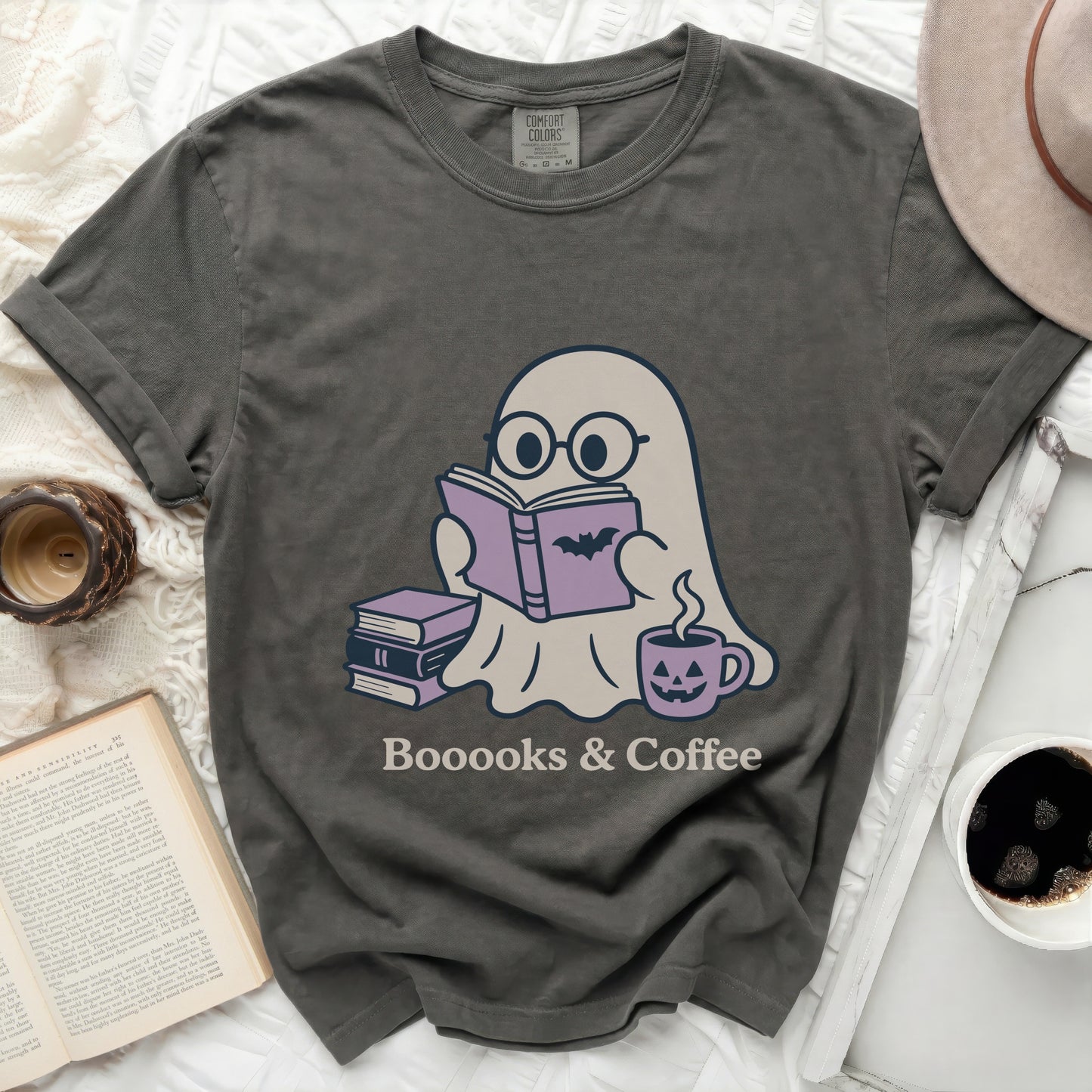 Ghost wearing glasses reading a book with text "Booooks & Coffee".