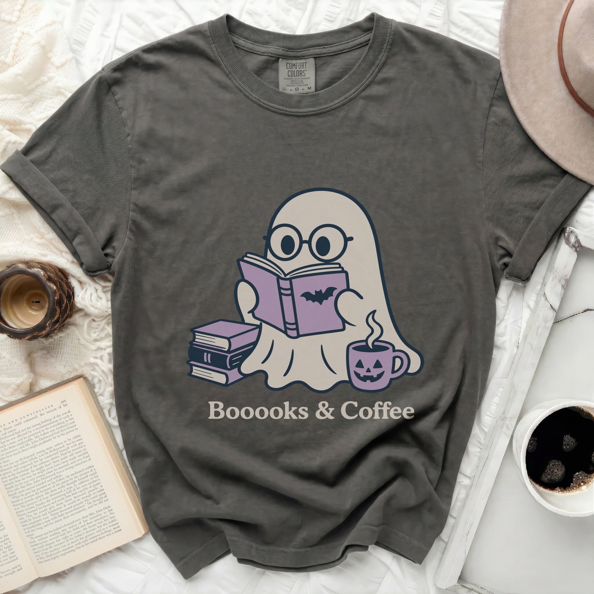 Ghost wearing glasses reading a book with text "Booooks & Coffee".