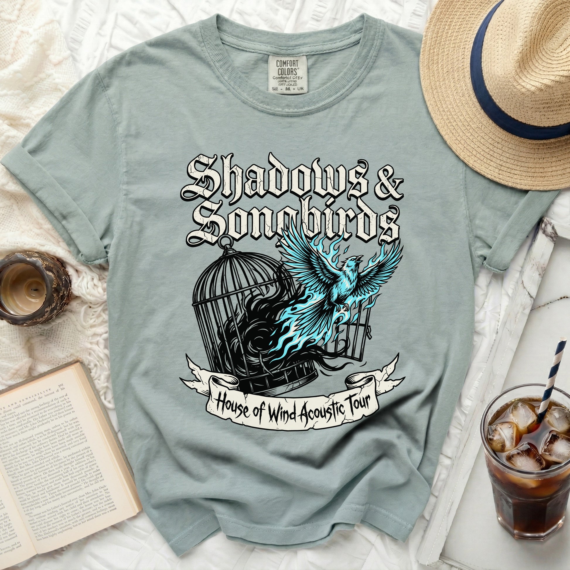 T-shirt with "Shadows & Songbirds" and "House of Wind Acoustic Tour" text.