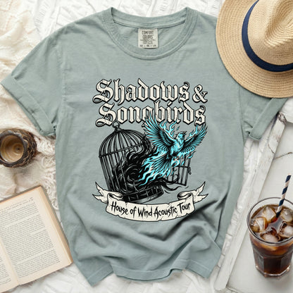 T-shirt with "Shadows & Songbirds" and "House of Wind Acoustic Tour" text.