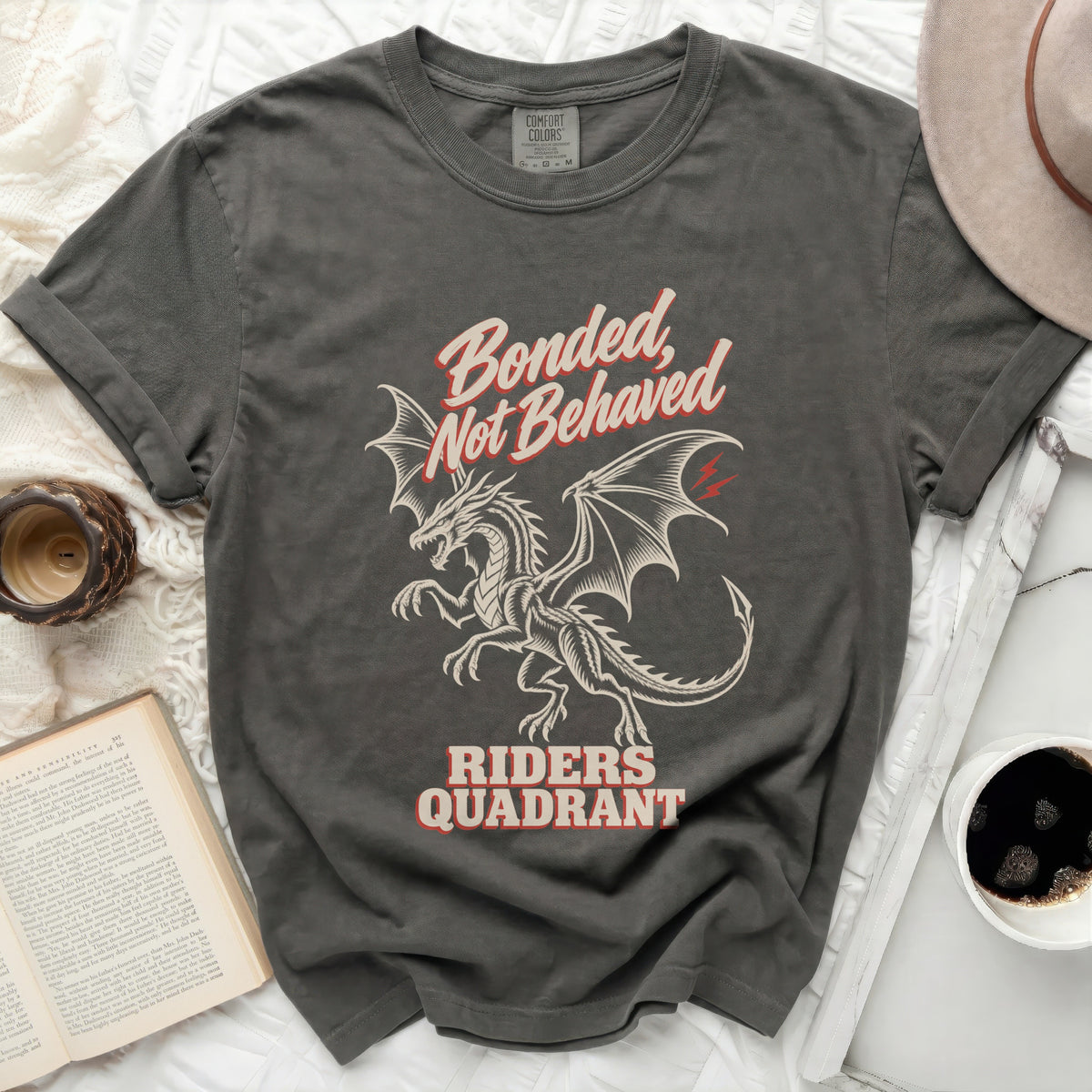 Dark gray t-shirt with a dragon graphic and "Bonded, Not Behaved Riders Quadrant" text.
