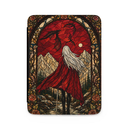 Stained glass design with woman in red cape facing dragons above mountains and moon.