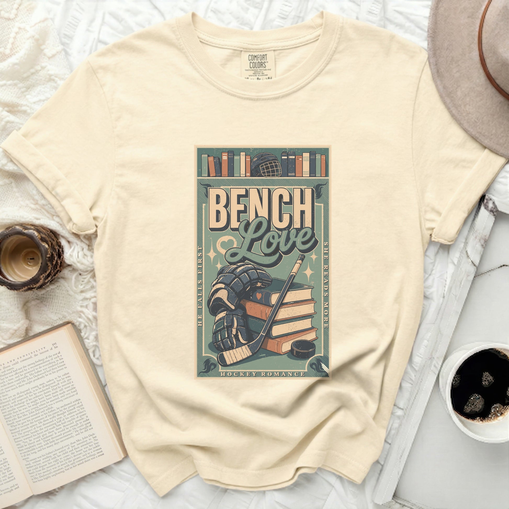 "Bench Love" graphic tee with hockey gear and books.