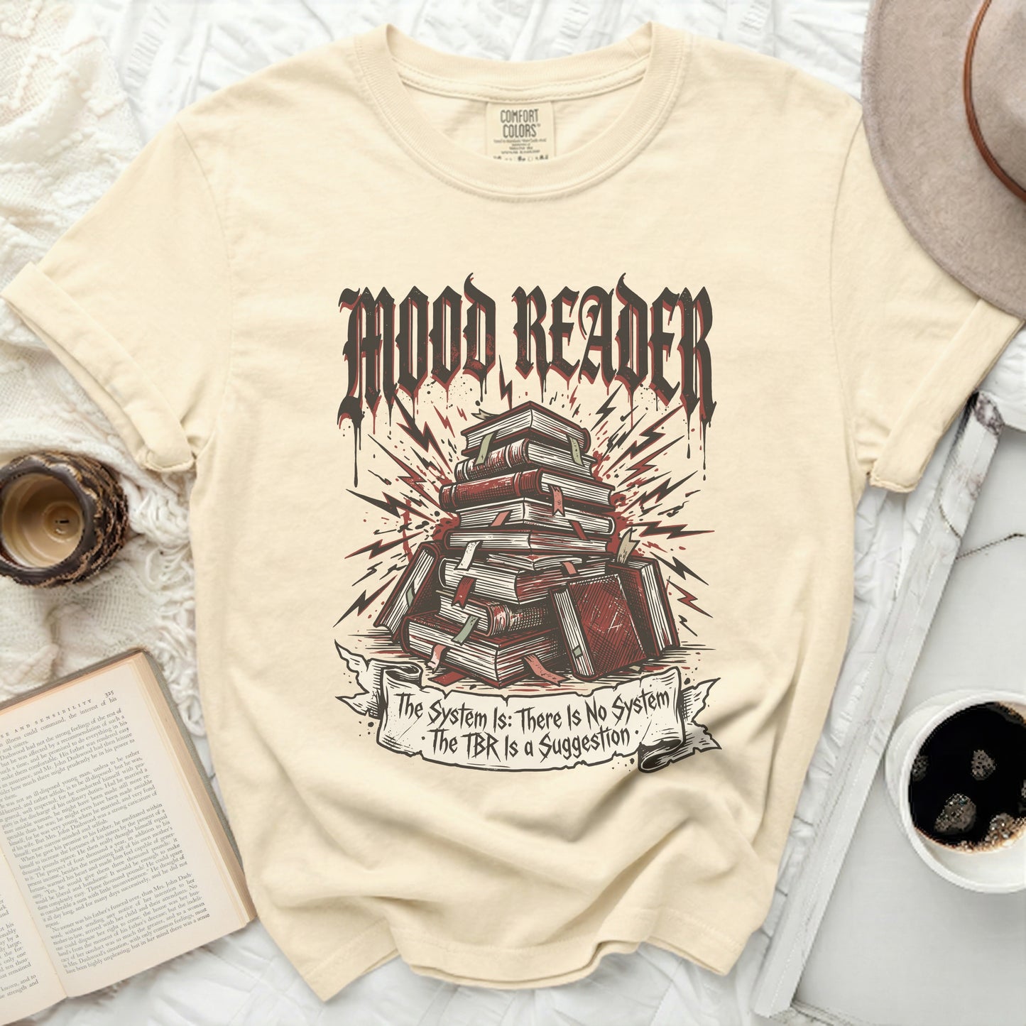 T-shirt with "Mood Reader" and stacked books, plus a banner with text.