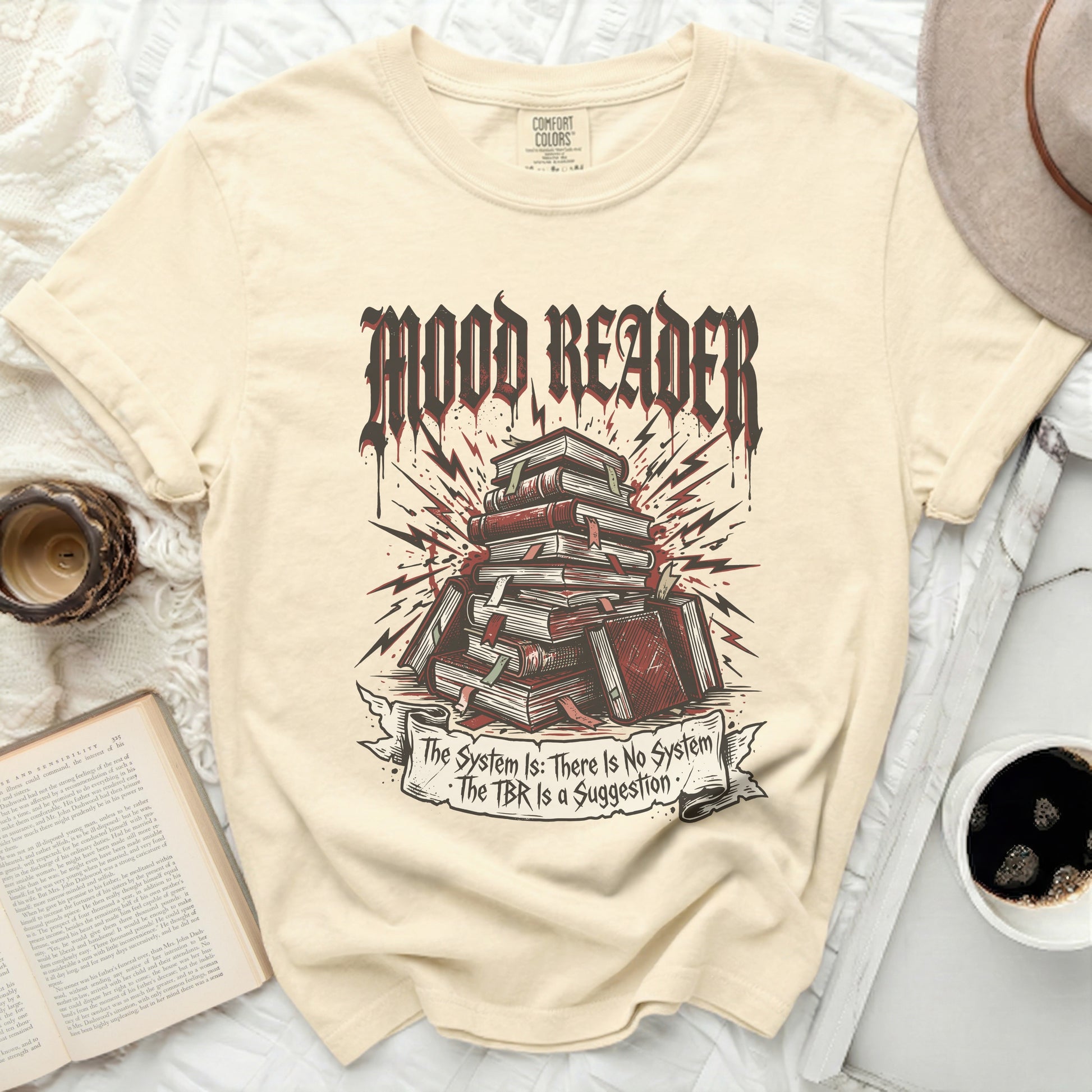 T-shirt with "Mood Reader" and stacked books, plus a banner with text.