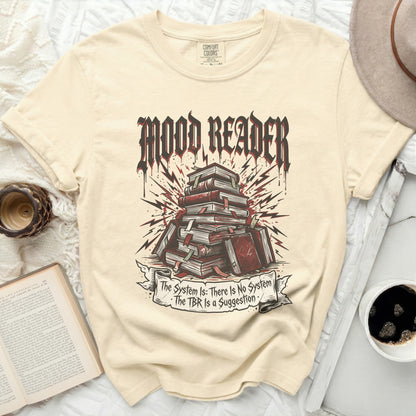 T-shirt with "Mood Reader" and stacked books, plus a banner with text.