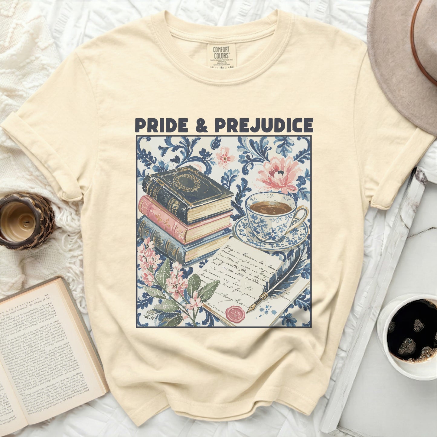 Cream t-shirt with "Pride & Prejudice" text and literary motifs.