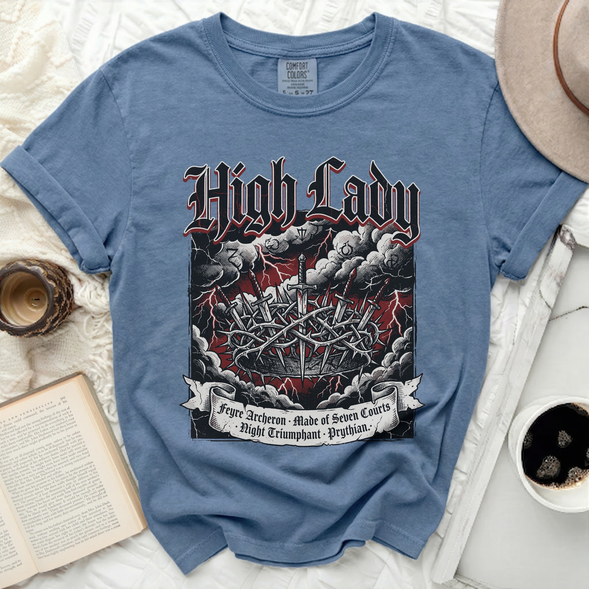 Blue t-shirt with "High Lady" text and swords in a crown of thorns.
