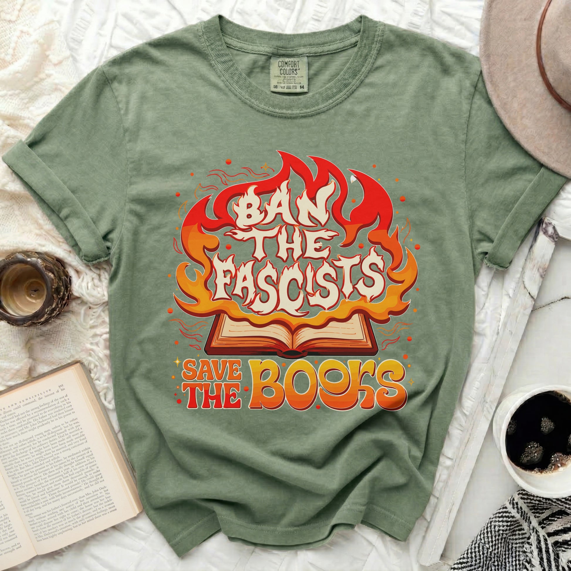 Green t-shirt with "Ban the Fascists Save the Books" graphic.
