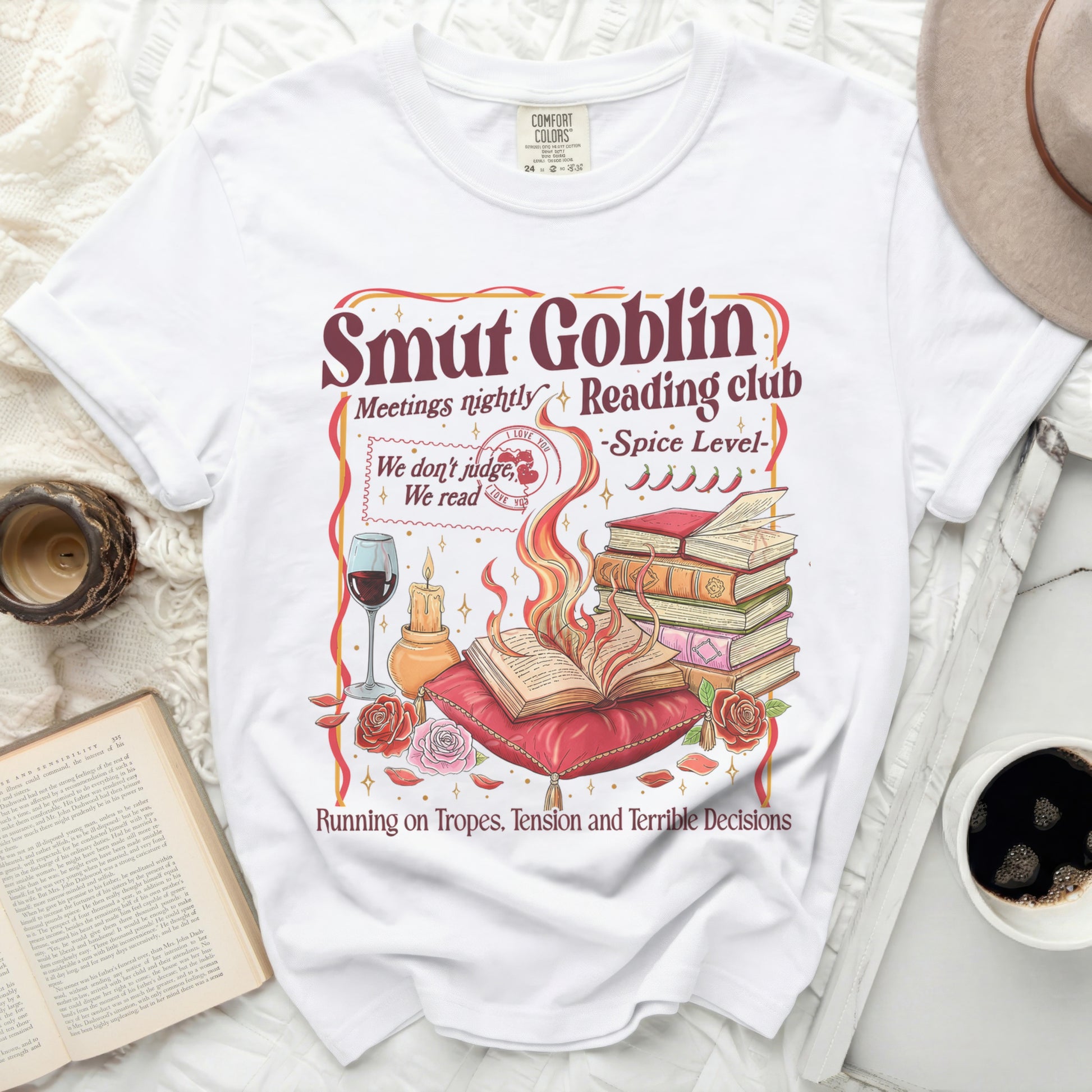 White t-shirt with "Smut Goblin Reading Club" design and humorous text.
