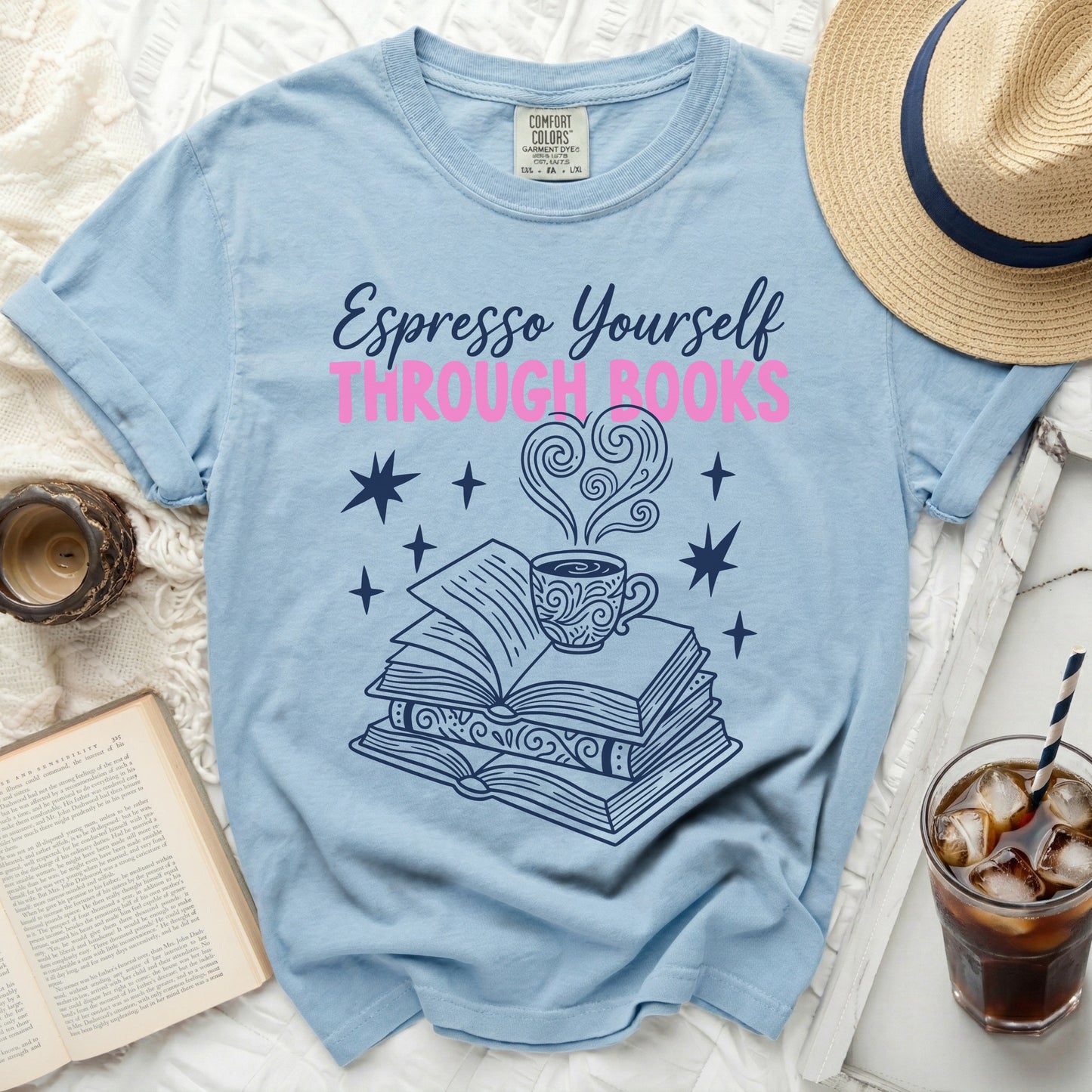 Light blue t-shirt with "Espresso Yourself Through Books" text.