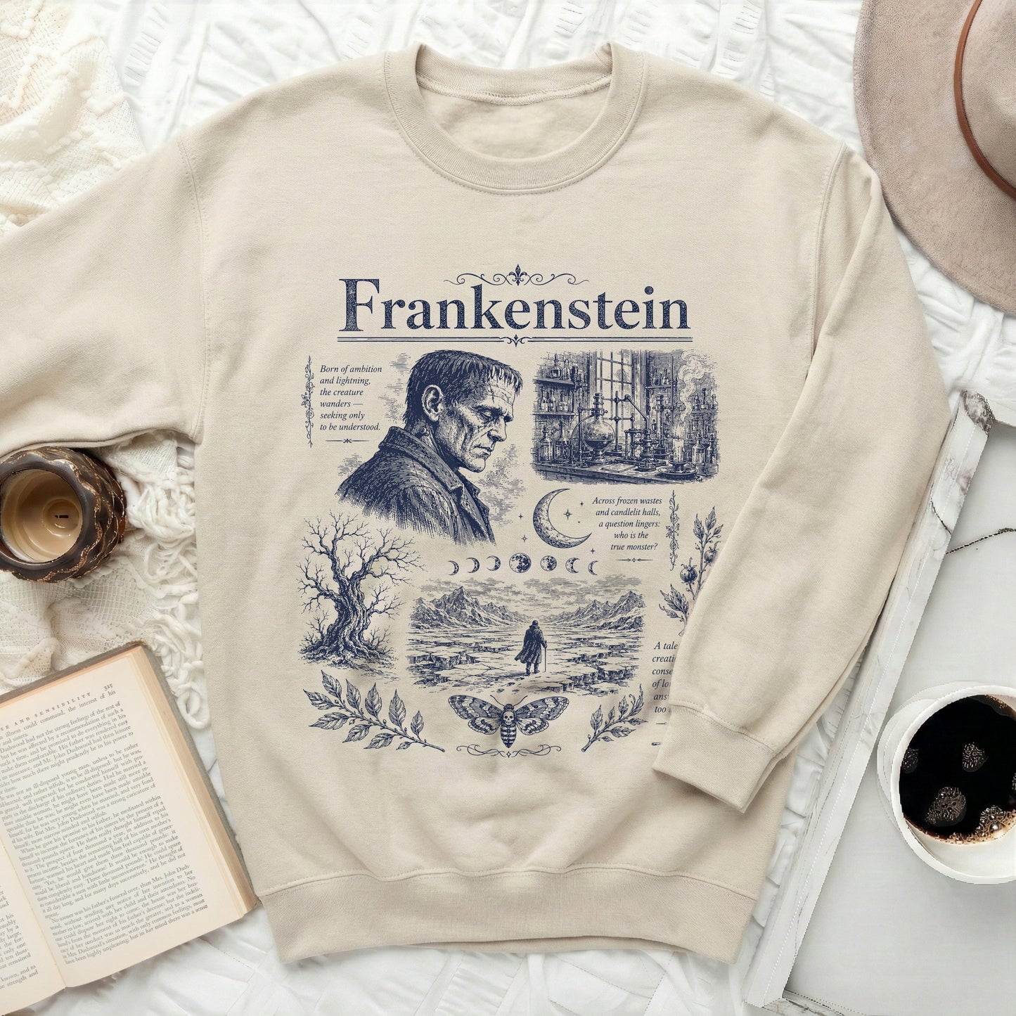 Light beige sweatshirt with a dark blue Frankenstein graphic and text.