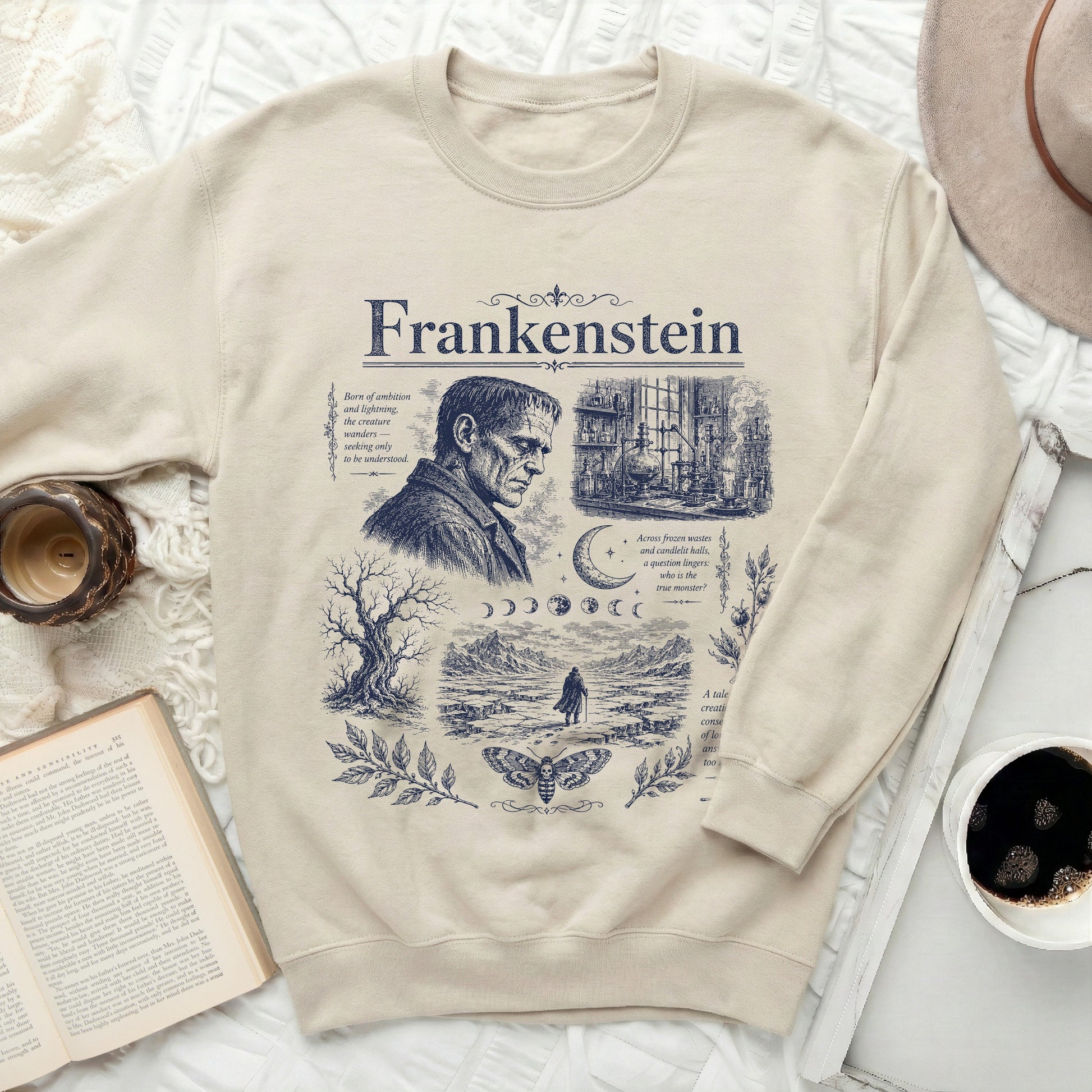 Light beige sweatshirt with a dark blue Frankenstein graphic and text.