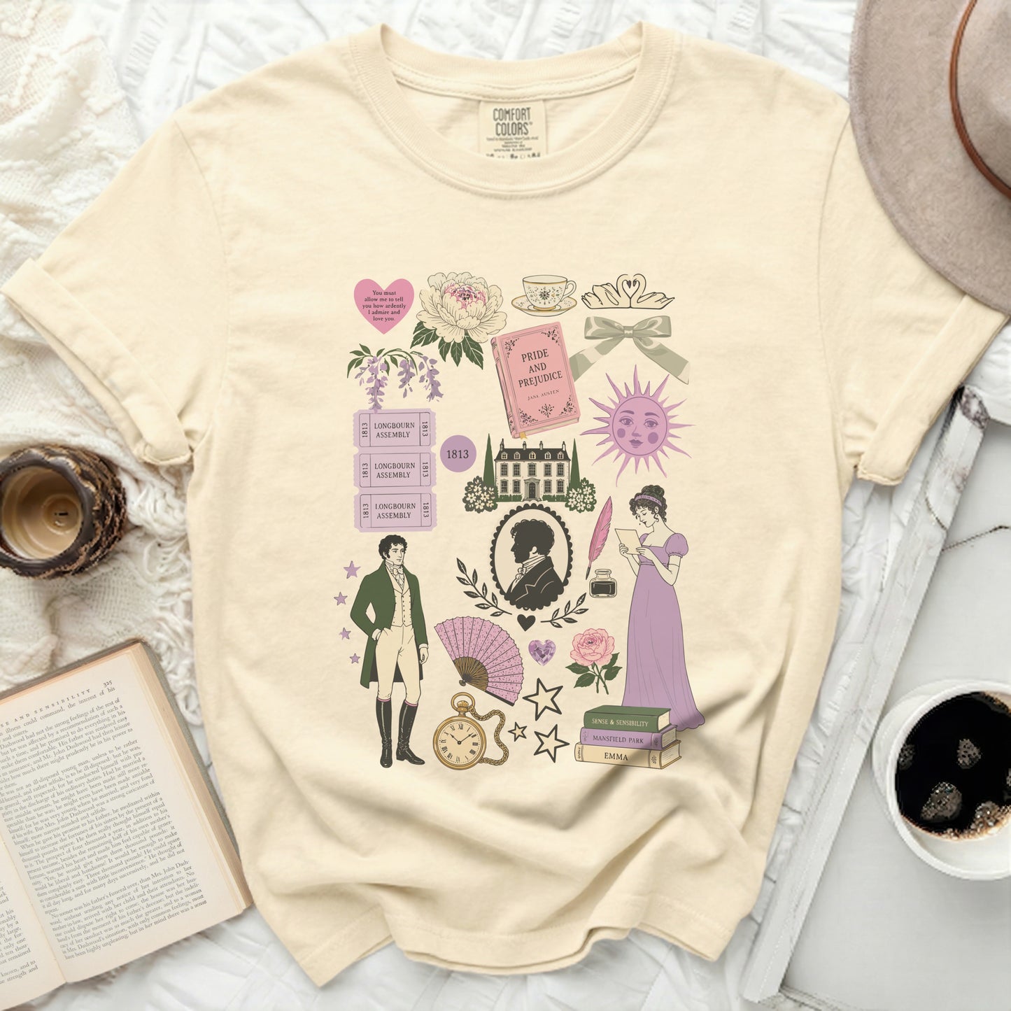 Cream t-shirt with Regency-era illustrations: Pride and Prejudice book, figures, and romantic motifs.