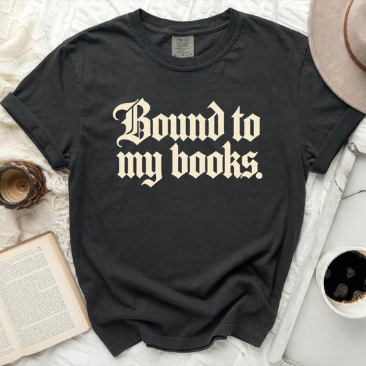 Dark gray t-shirt with "Bound to my books." text in cream Gothic font.