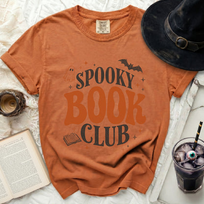 Orange t-shirt with "Spooky Book Club" graphic, ghost, bat, and book.