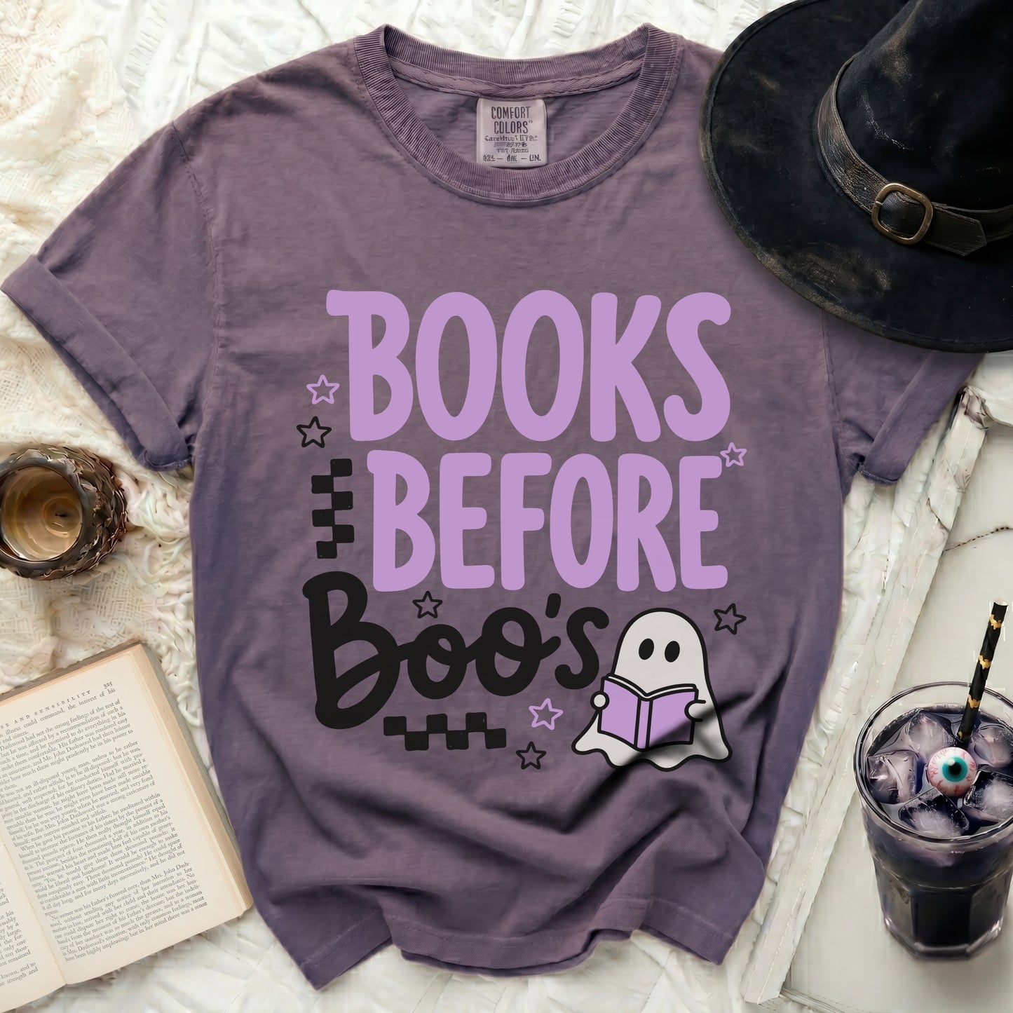 Purple t-shirt with "Books Before Boo's" and ghost graphic.