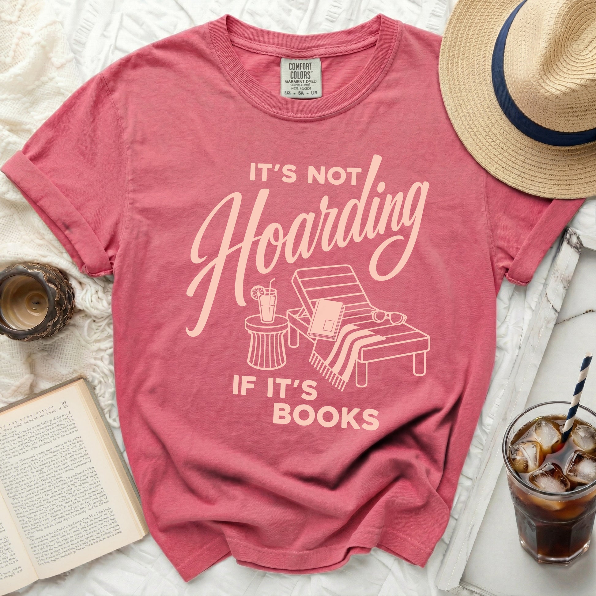 Pink t-shirt with "It's not Hoarding If It's Books" text.