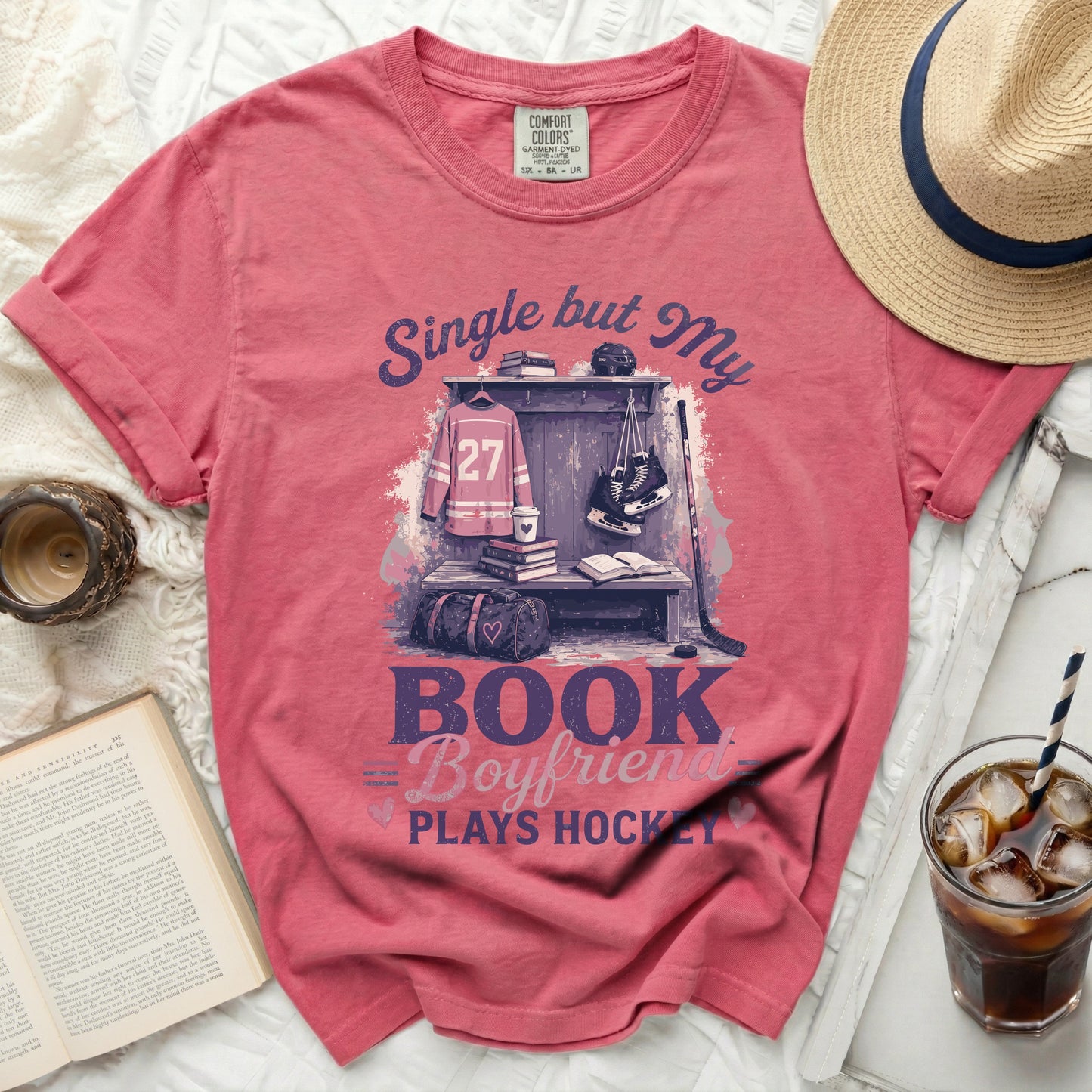 Pink t-shirt with "Single but My Boyfriend Plays Hockey" text and hockey gear.