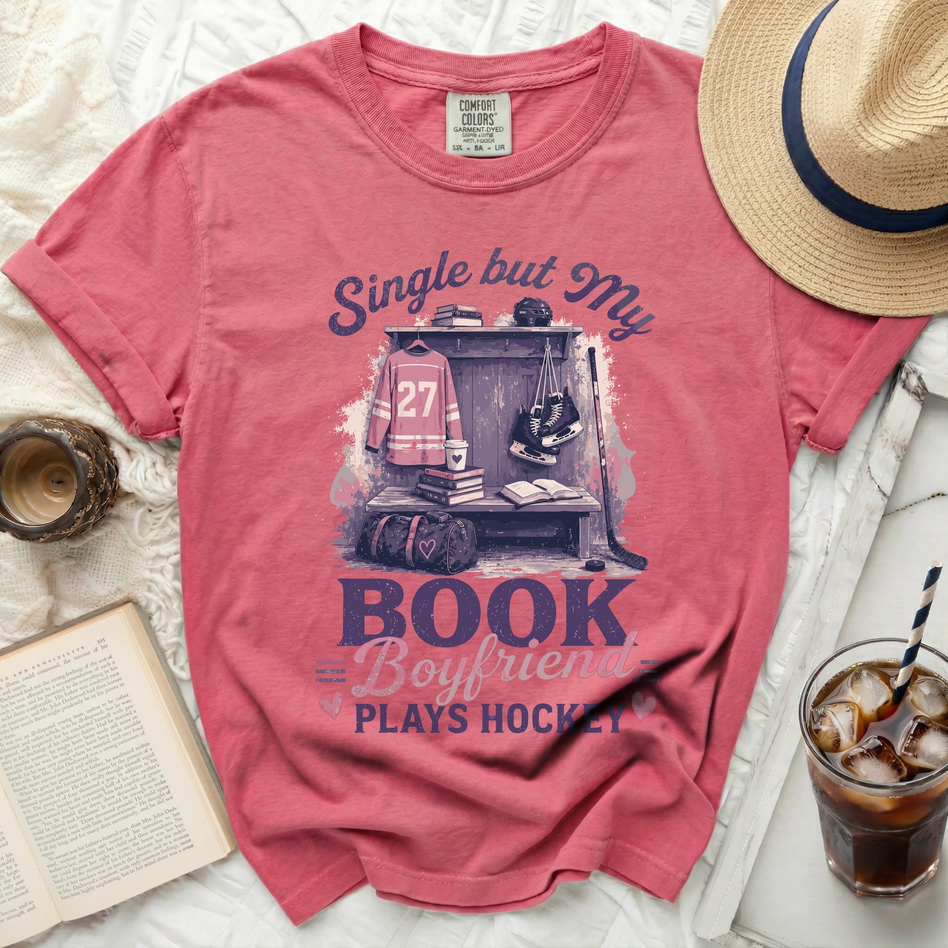 Pink t-shirt with "Single but My Boyfriend Plays Hockey" text and hockey gear.