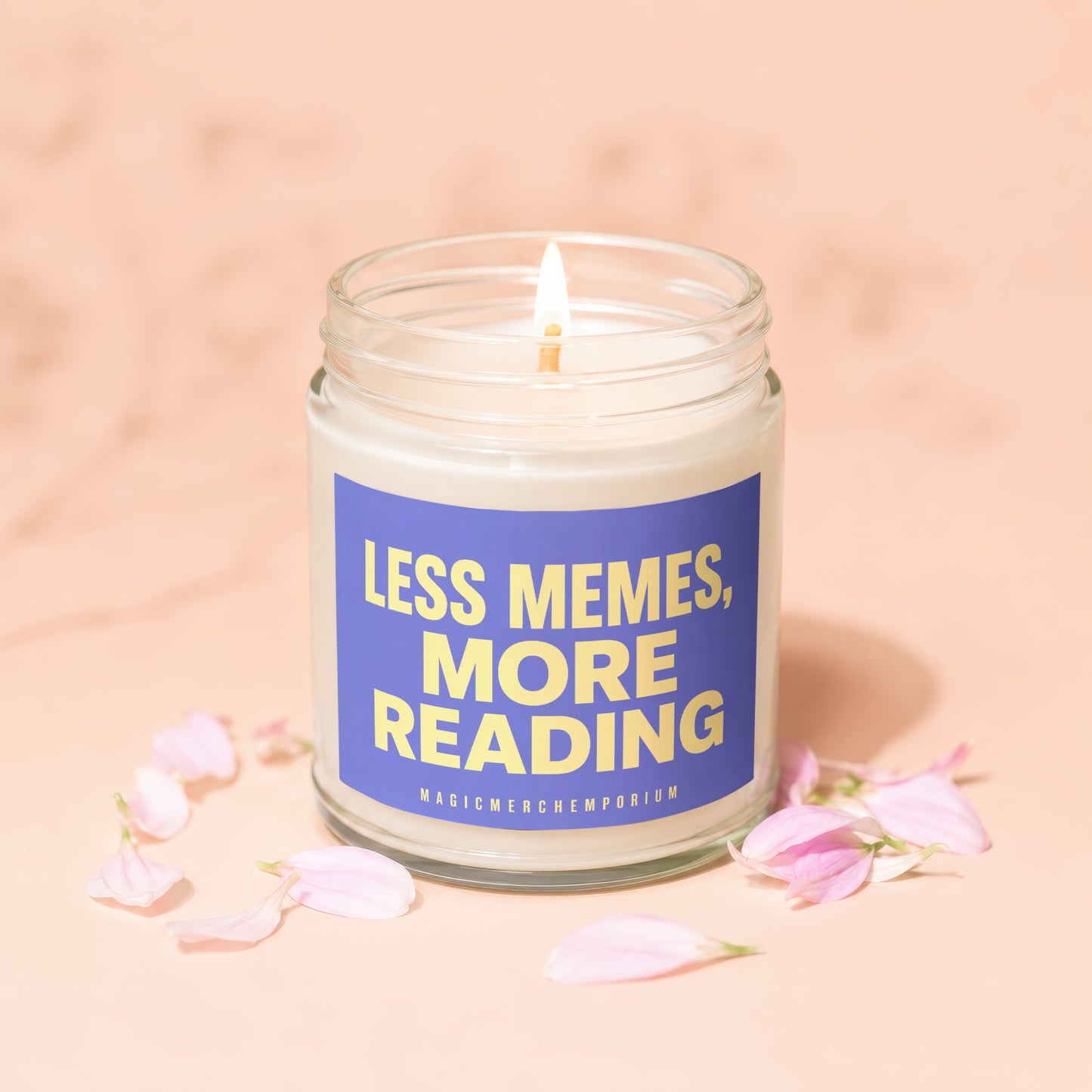 Lit candle in jar with "Less Memes, More Reading" text, surrounded by petals.