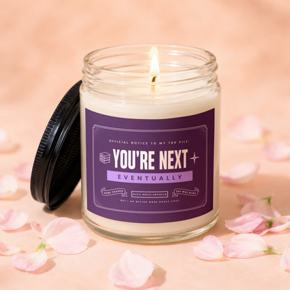 Lit candle with "You're Next Eventually" text about TBR pile.