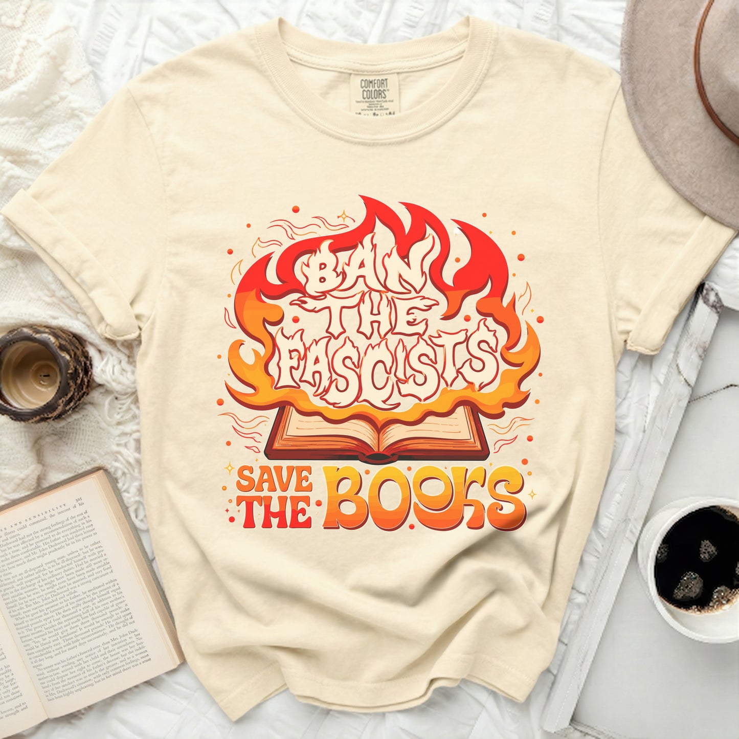 Ban the fascists, save the books, on a cream t-shirt.
