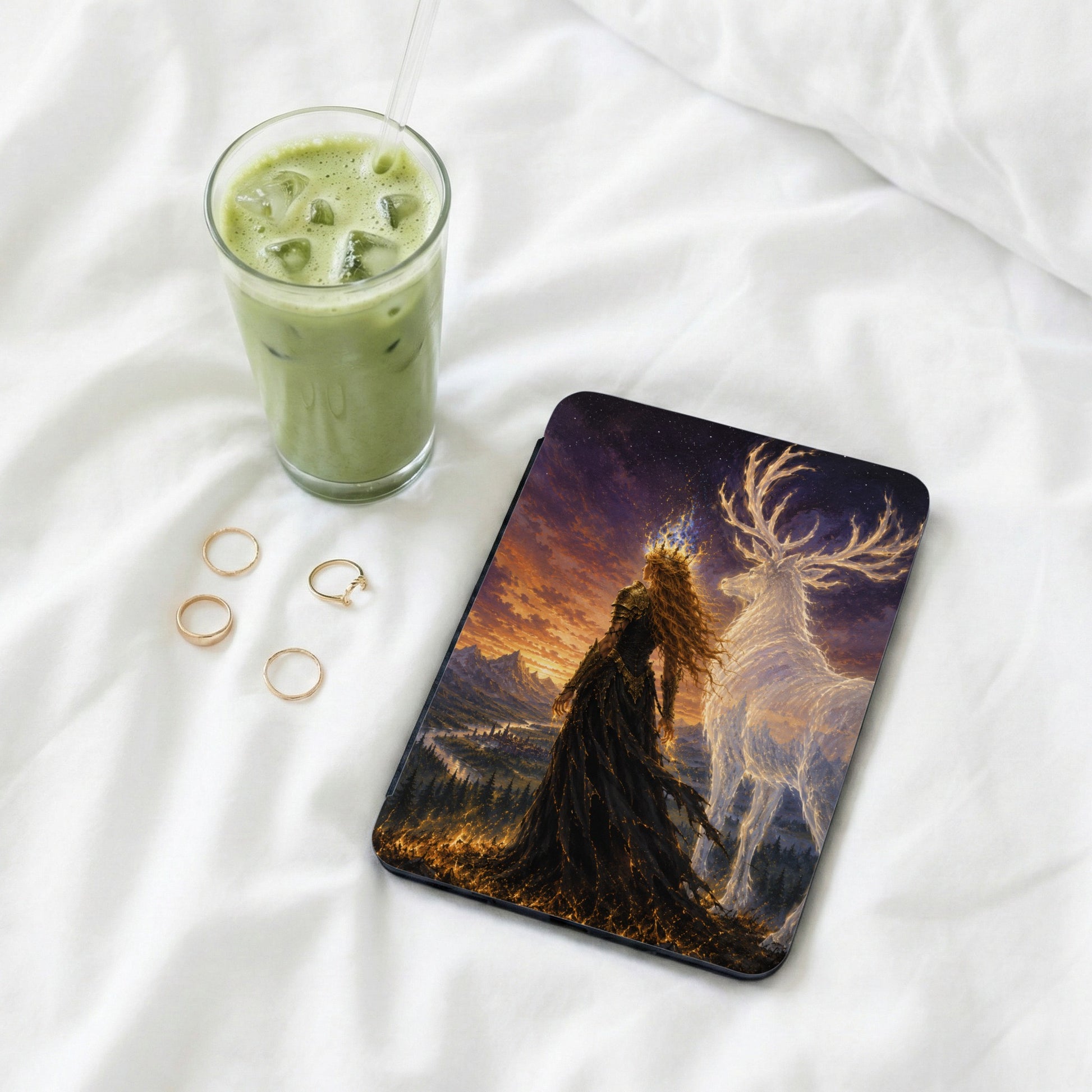 Tablet with artwork of a woman and spectral deer in a fantastical landscape.
