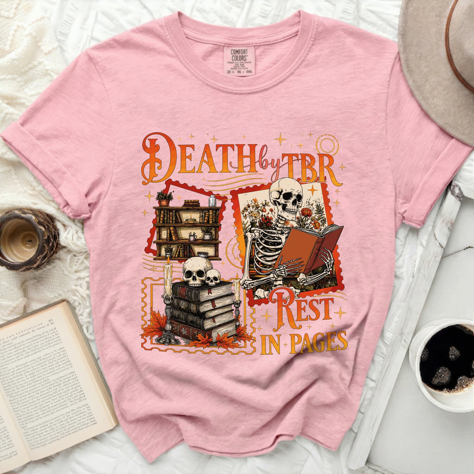 Pink t-shirt with skeleton reading and quote: "Death by TBR, Rest in Pages"